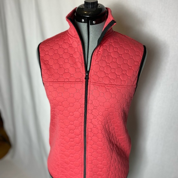 Swing Golf Vest in coral. - Picture 1 of 11